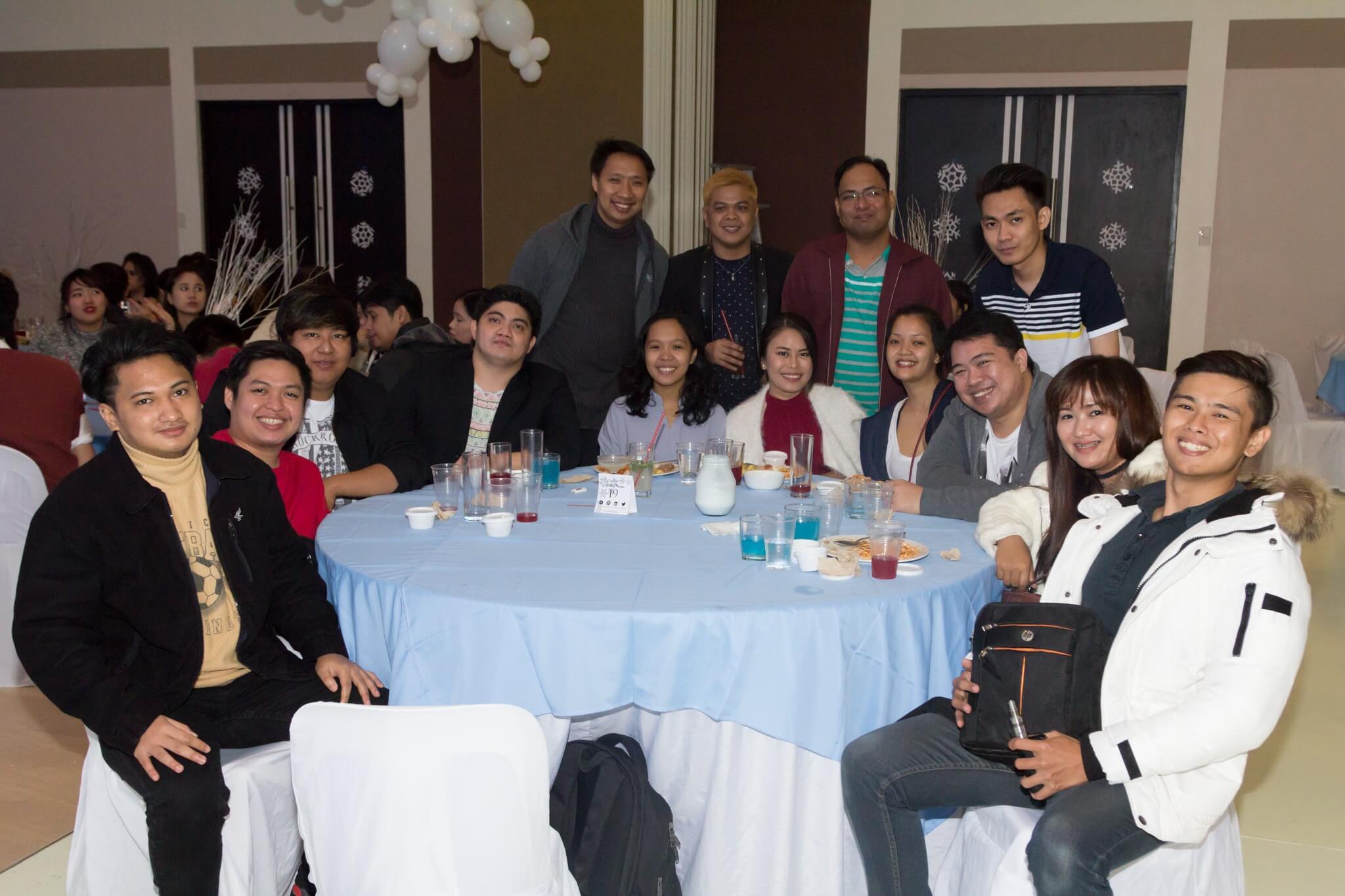 image of 2ndoffice employees around a dining table in a party